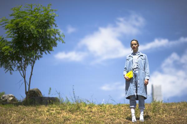 model posing a top a hill.
