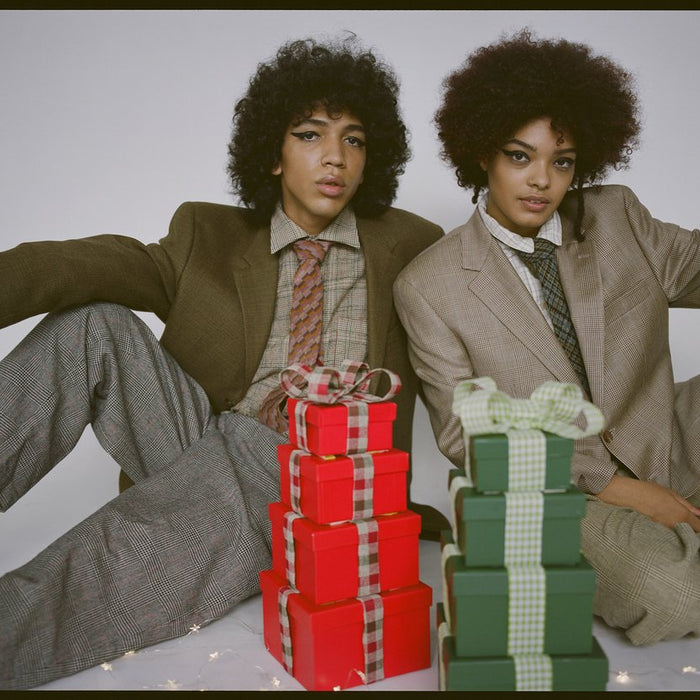 two models in suiting and presents.