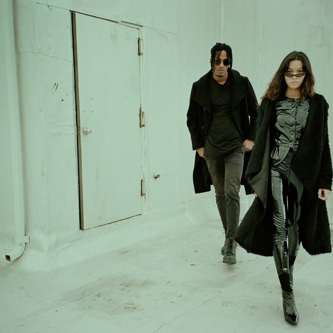 models walking on a roof.