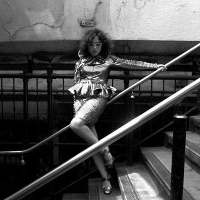 model posing on stairs of train station