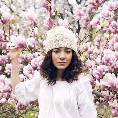 portrait of aisha gunnell with flowers.