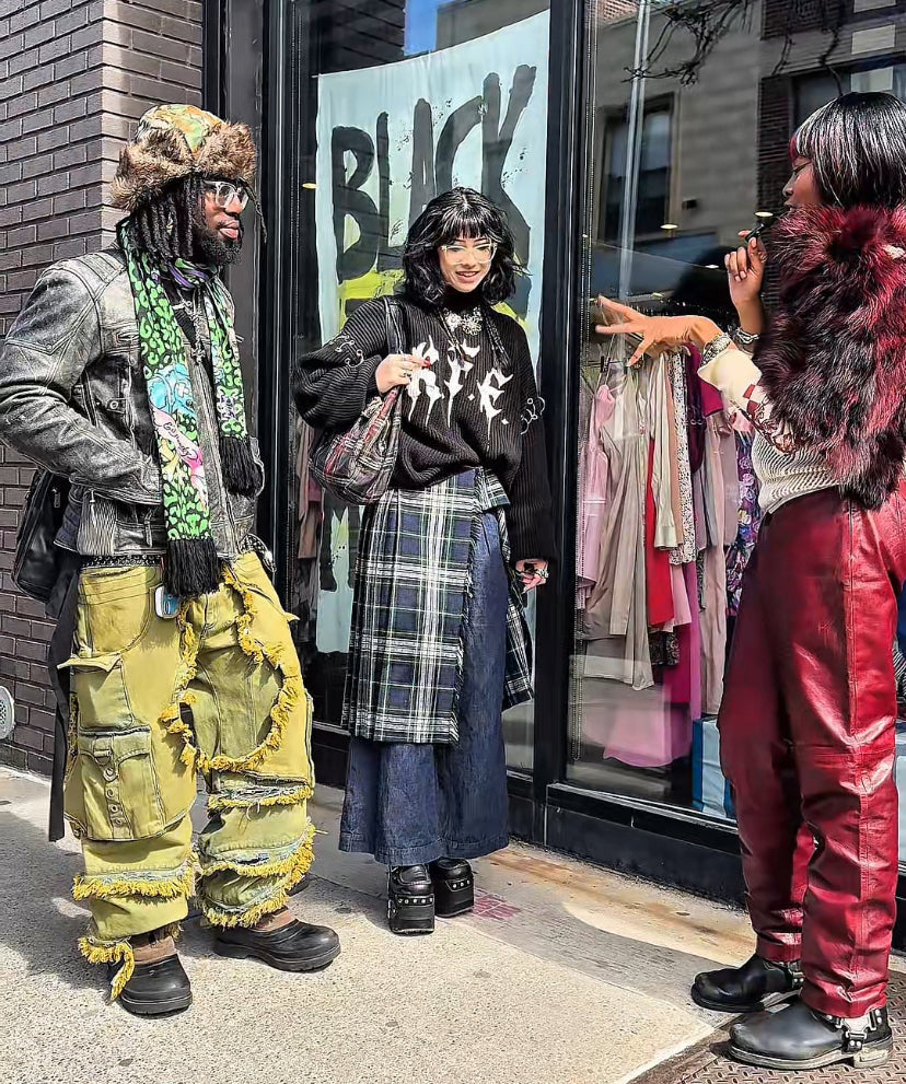 picture of gerald, peggy and odera all wearing really cool outfits