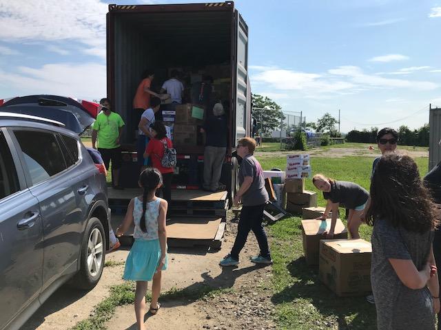 volunteers loading truck.