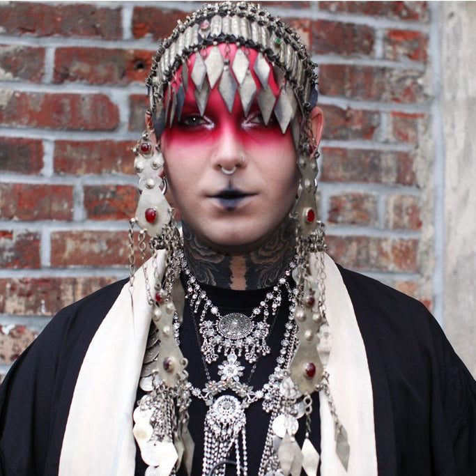 patron in berber headpiece.