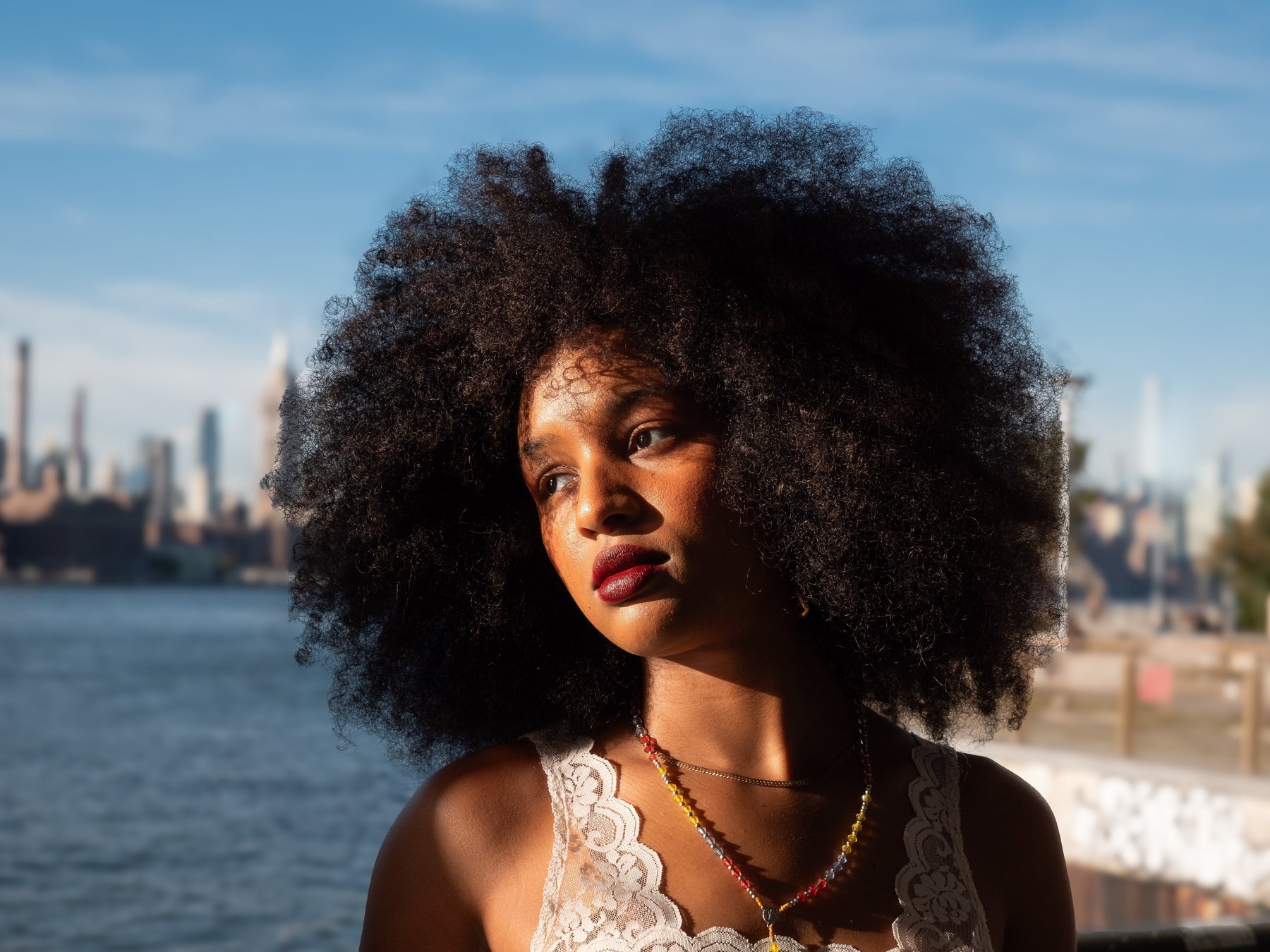 portrait of angelique with cityscape in back