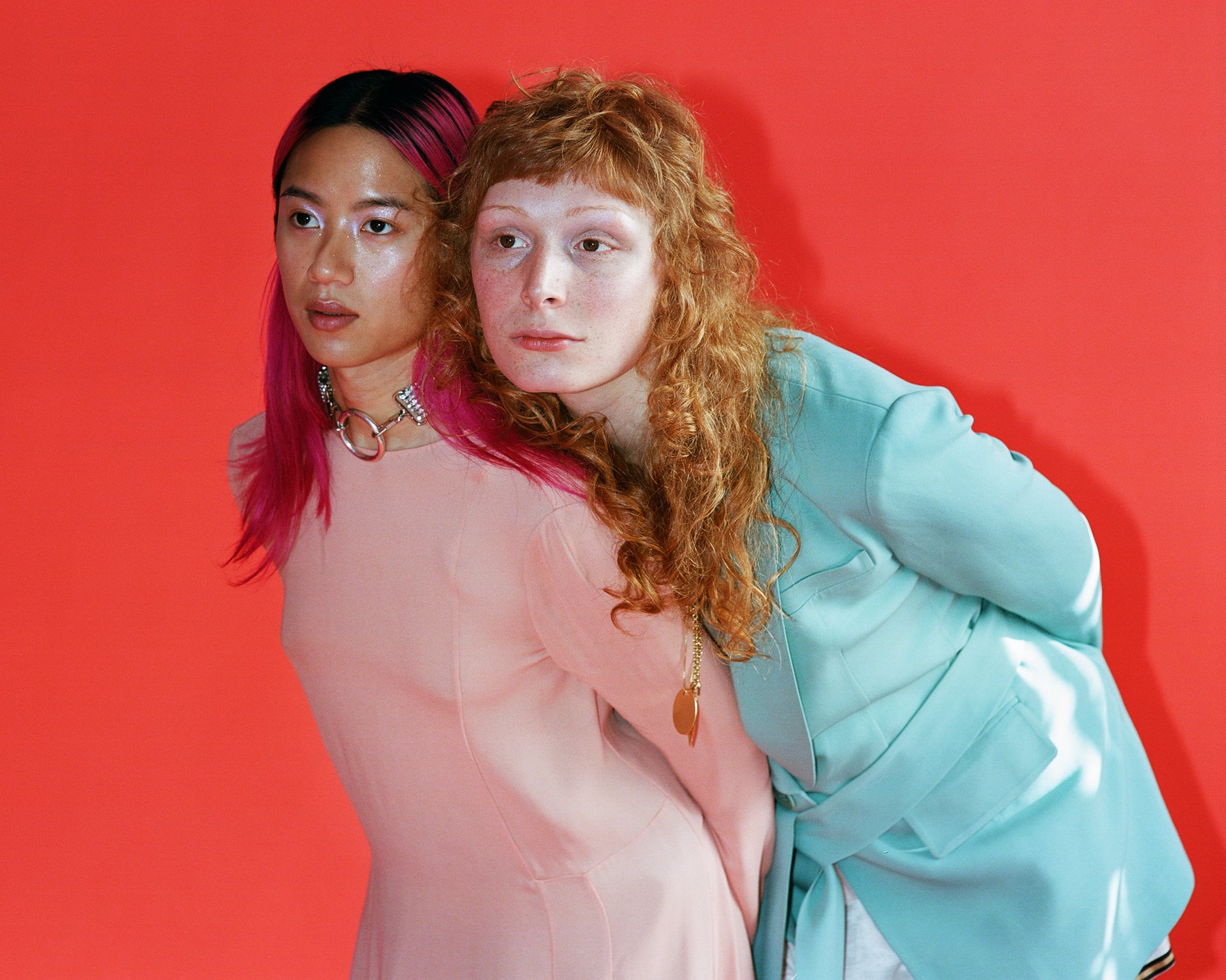 two models leaning on each other.