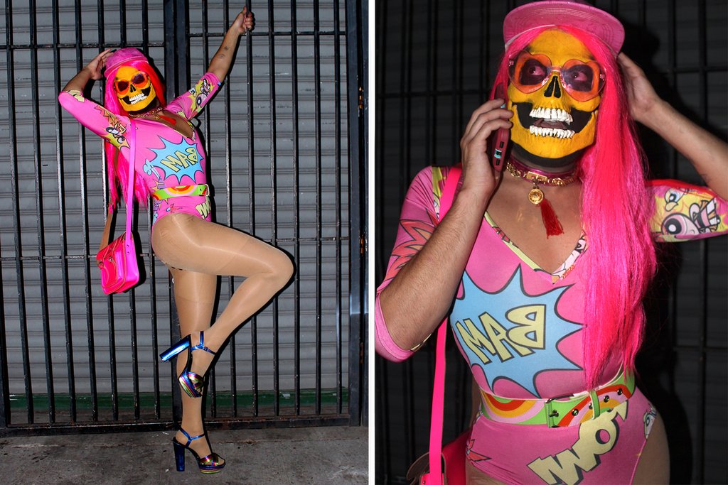 nicky ottav in 'boom', 'bam' powerpuff girls graphic leotard and painted skeleton face leaning on fence and nicky ottav talking on cell phone.
