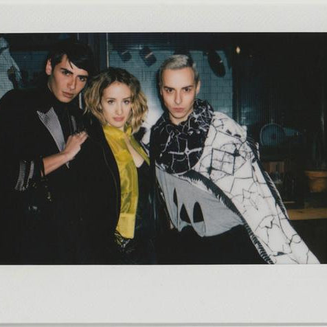 employees posing for the camera.