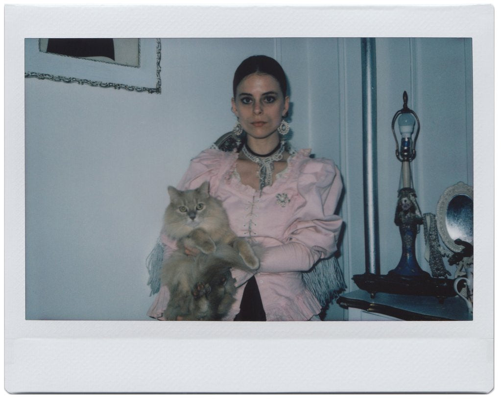 portrait of tatum and their cat.