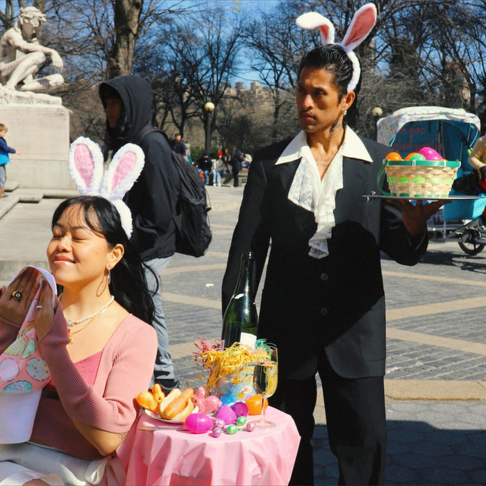 image of models in bunny ears dining in central park