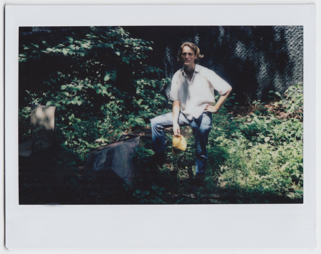 calvin seated in their backyard.