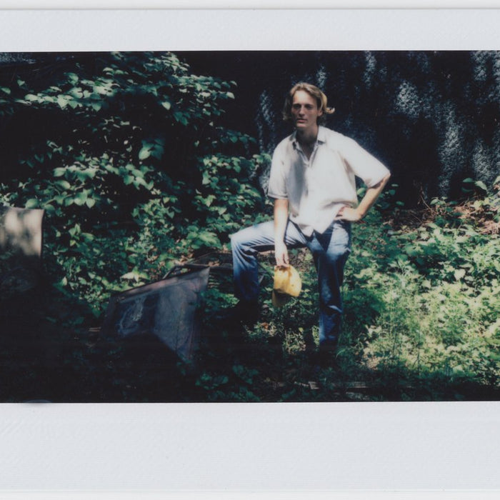 calvin seated in their backyard.