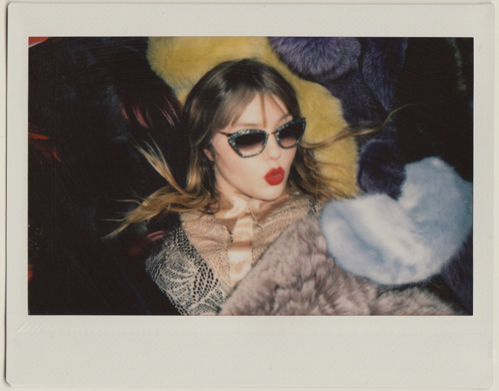 portrait of clare in sunglasses and lipstick.