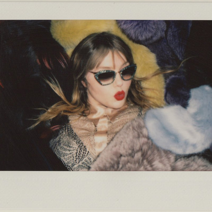 portrait of clare in sunglasses and lipstick.