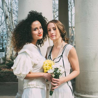 models portrait holding flowers.