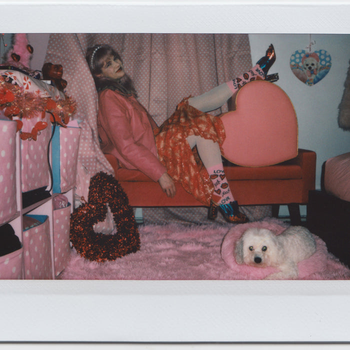 jeanette in their heart themed room with cute dog.