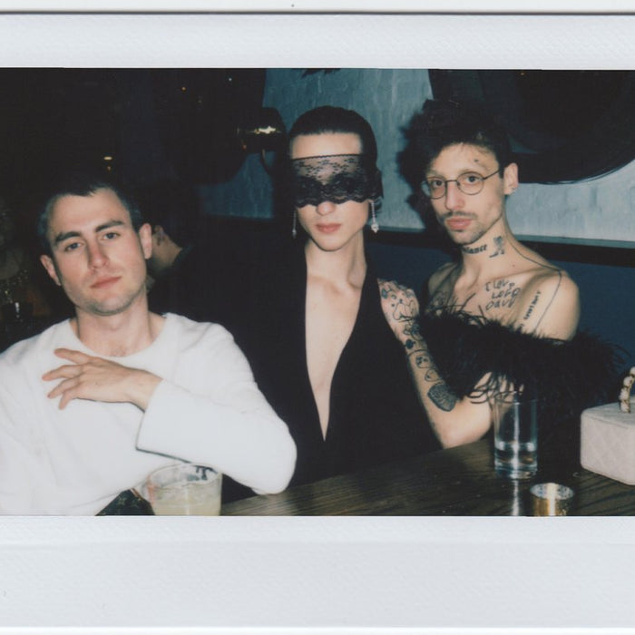 trio elegant posing for the camera - polaroid style.