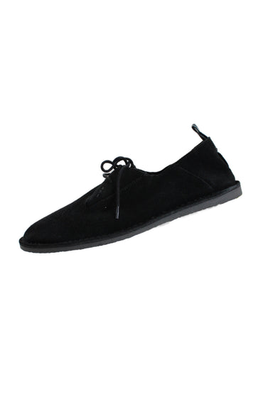 side angle of shoe the bear black suede lace up shoes. features black outstitching, round laces, blue stripe pull tab, and thin rubber sole.