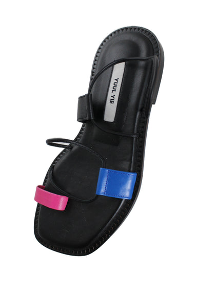 above angle of sandals with blue and pink strap detail.