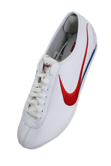 upper angle of nike sneakers. features text 'nike' with swoosh on tongue.