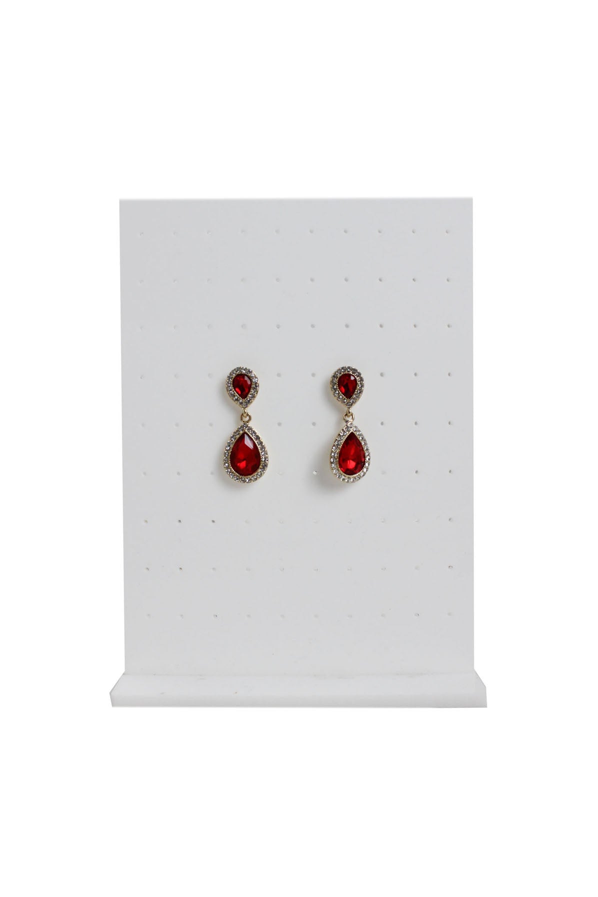 monet red double tear drop shaped earrings staged on an earring stand.