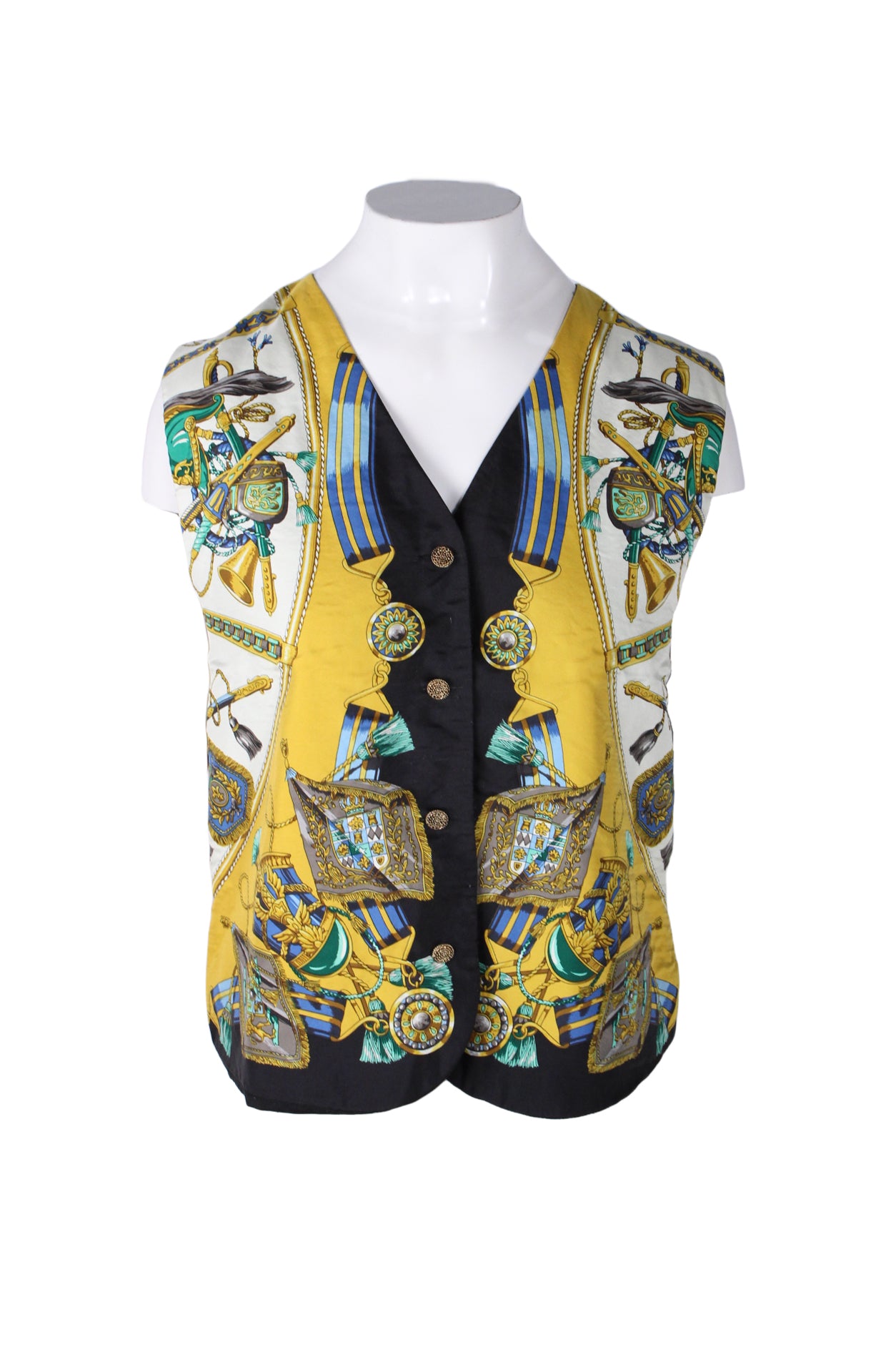 front angle of vintage rafaella gold/black/multicolored silk vest on fem mannequin. features high v-neck collar, four gold button closure down center, military inspired silk style printed fabric on front, and black back/lining.