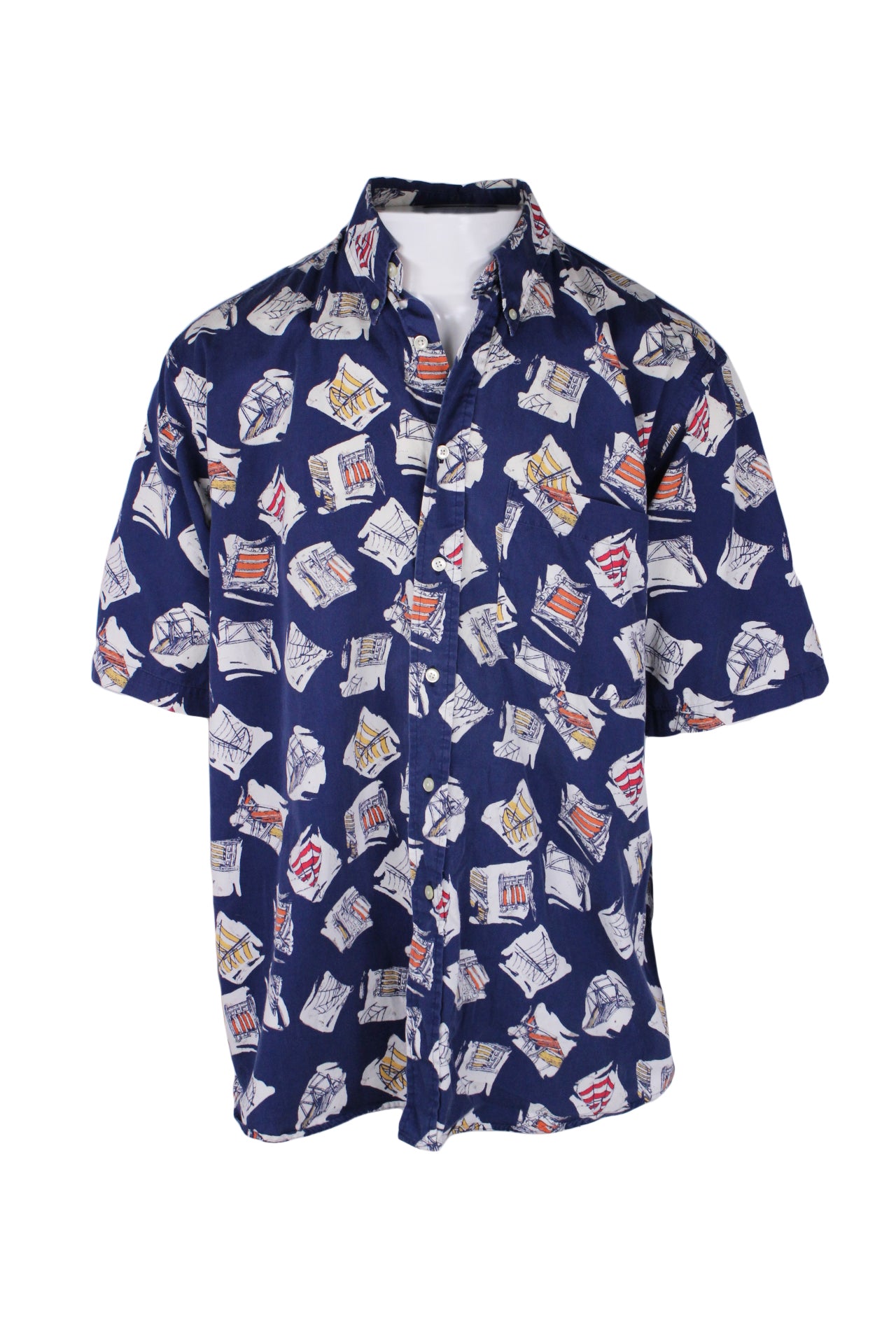 front angle of nautica blue/multi short sleeve button up shirt on masc mannequin torso. features beach chair and umbrella graphic pattern throughout, left breast pocket, and button down collar.