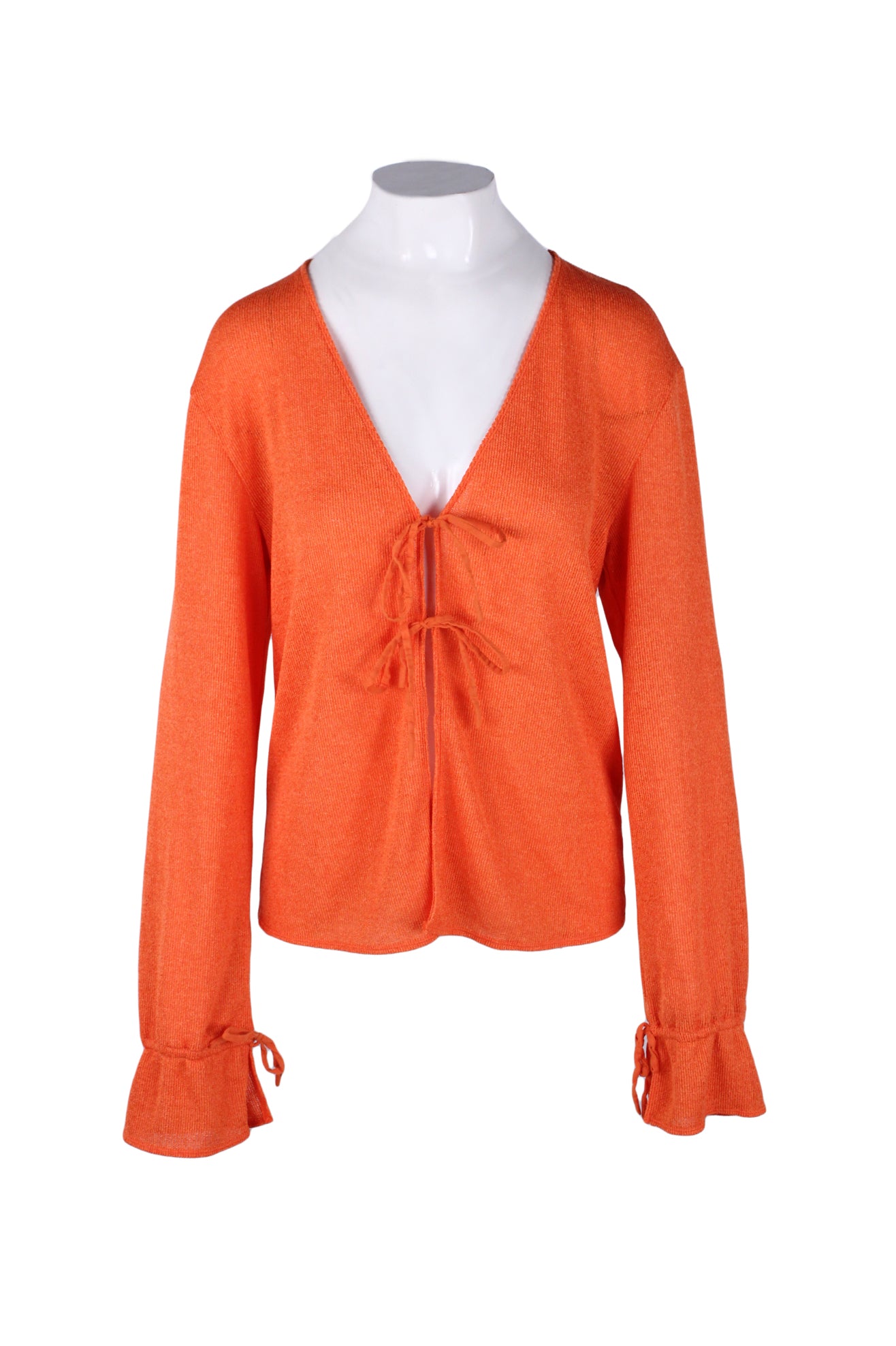 front of free people orange long sleeve cardigan. features v neckline, double self tie at front, and adjustable drawstring at cuffs.
