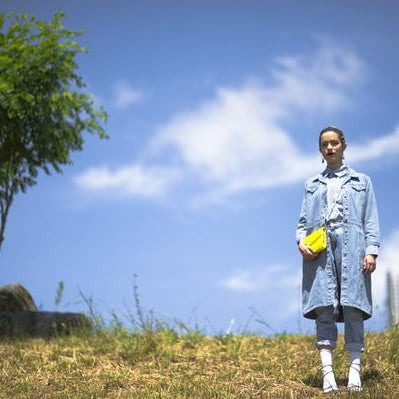 model posing a top a hill. 