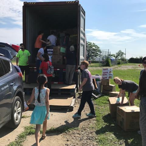 volunteers loading truck. 