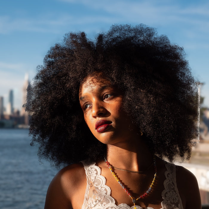 portrait of angelique with cityscape in back