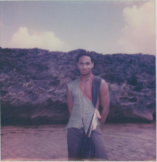 jesus posing in front of rocks. 