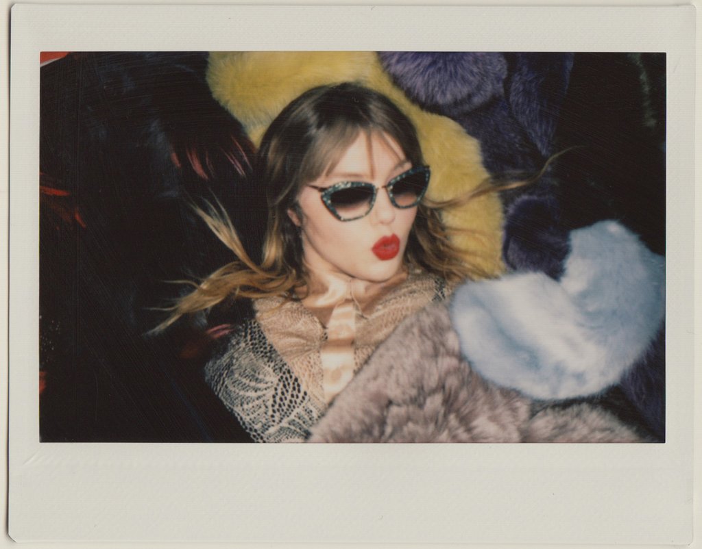 portrait of clare in sunglasses and lipstick. 