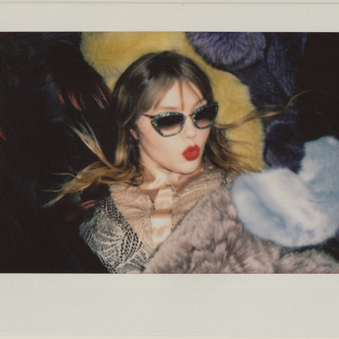 portrait of clare in sunglasses and lipstick. 