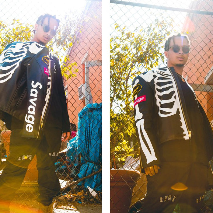 diptych of levygrey with draped skeleton themed leather jacket with 'savage' on sleeve and levygrey in jacket in front of fence.