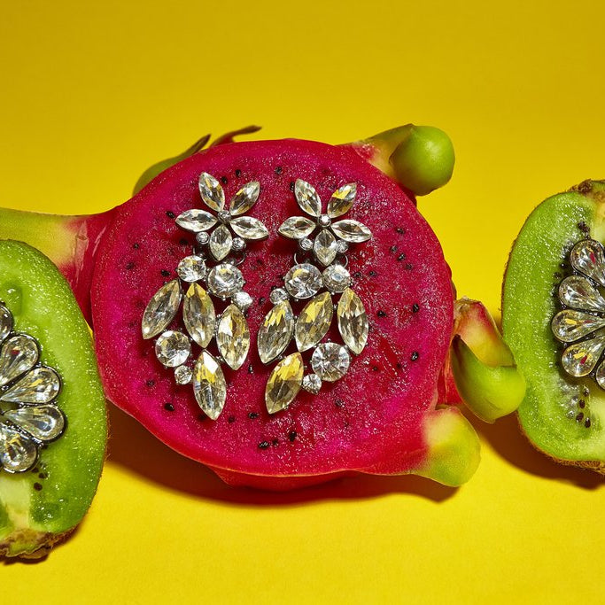 kiwi and dragon fruit with earrings still life. 