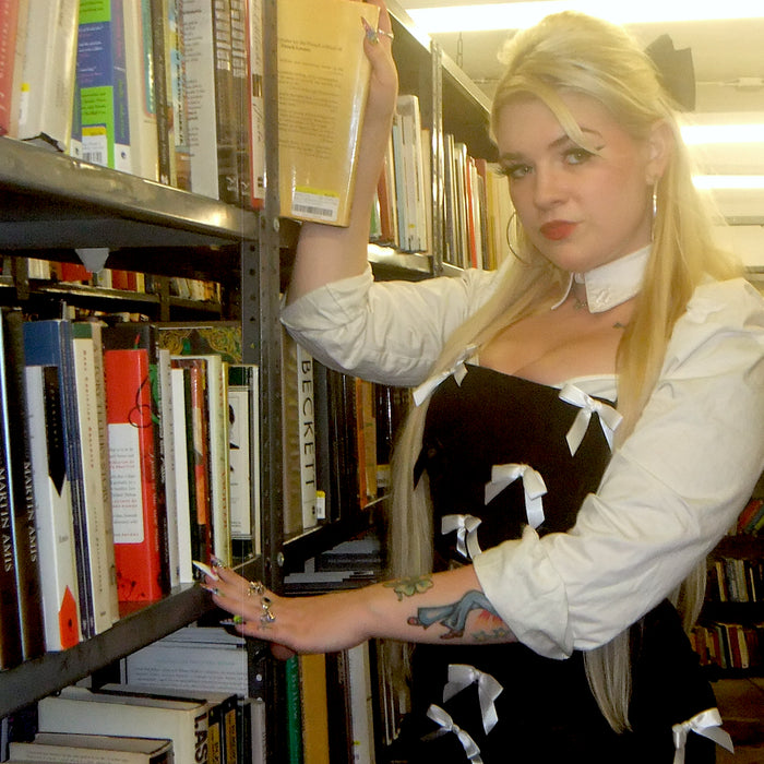 model posing in library aisle 