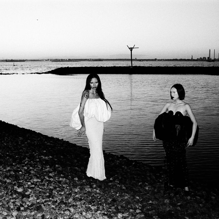 eery editorial image of models by lake
