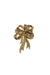 front angle of vintage oscar de la renta gold toned bow brooch with pin back closure. 