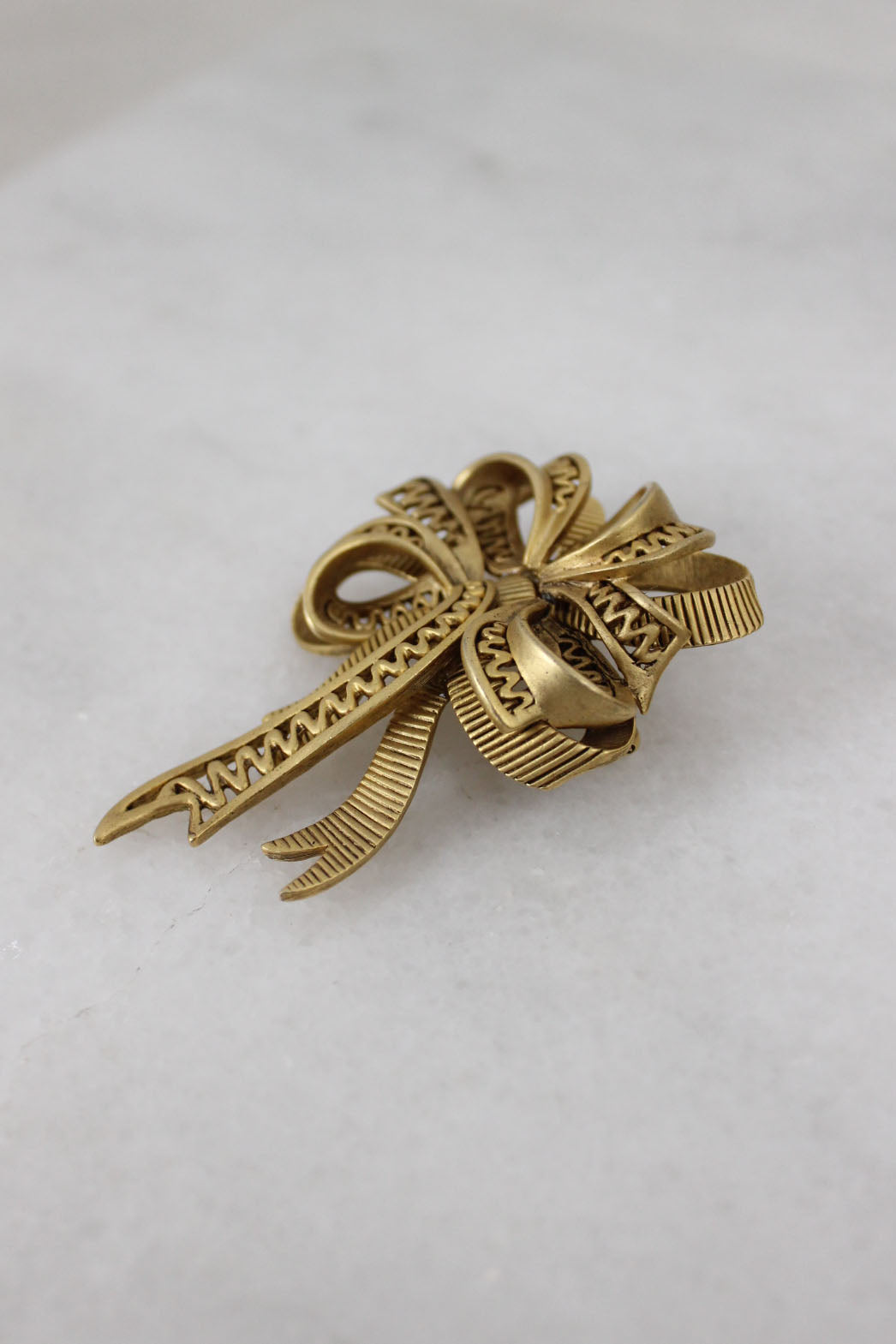 side angle of bow brooch. 