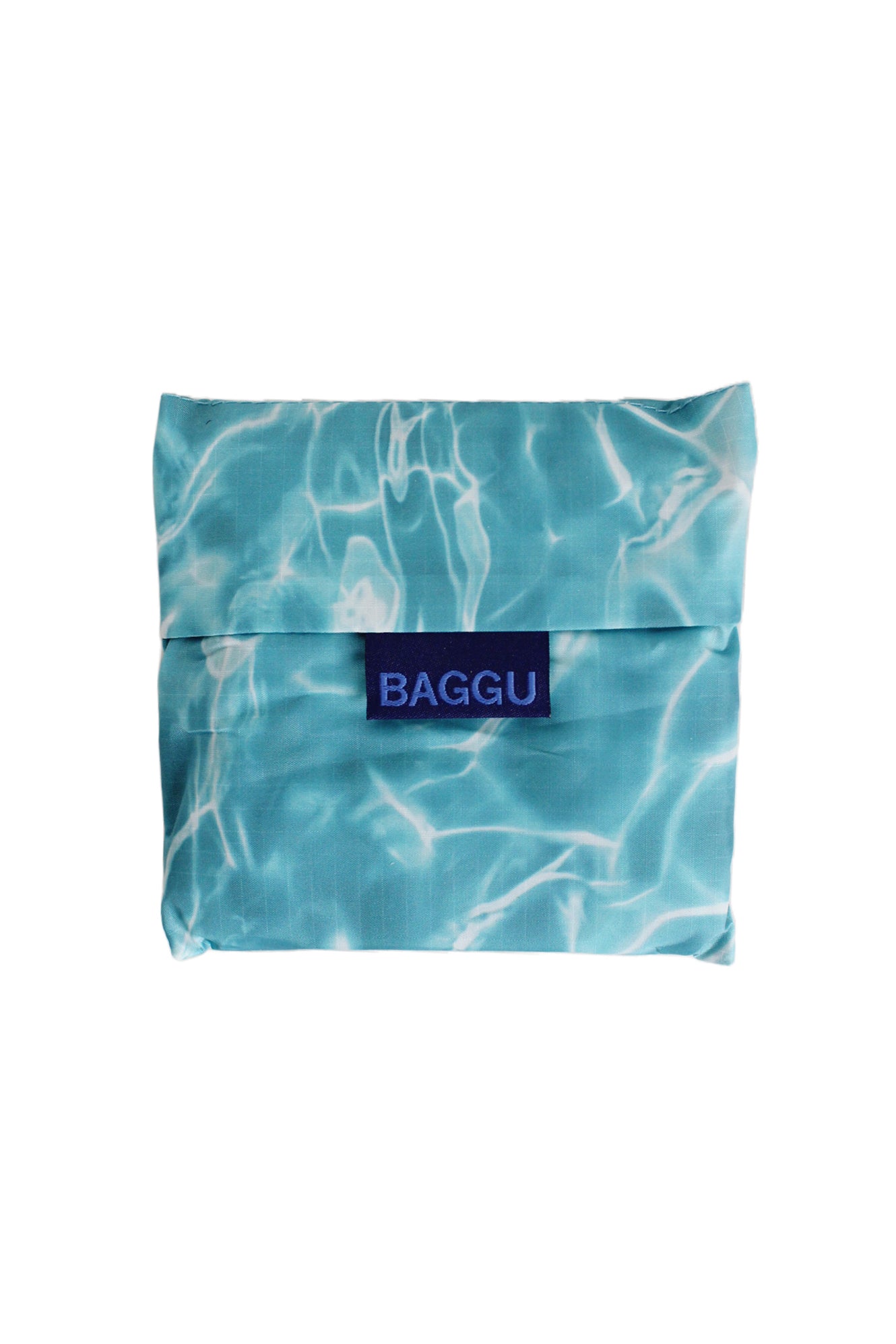 baggu blue pool standard reusable tote bag. features lightweight nylon fabric, two handles, and branded outer tag. 