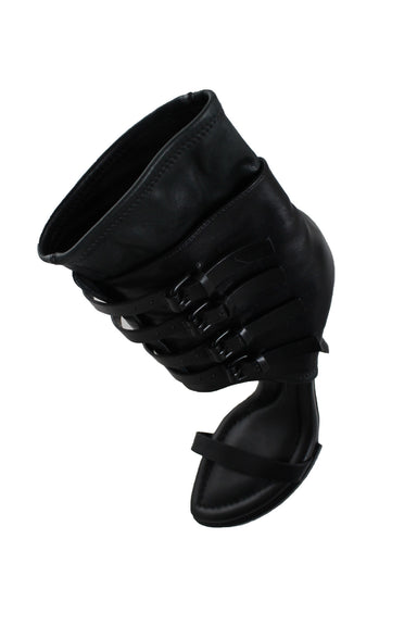 top view of alexander wang gladiator black leather sandals. 