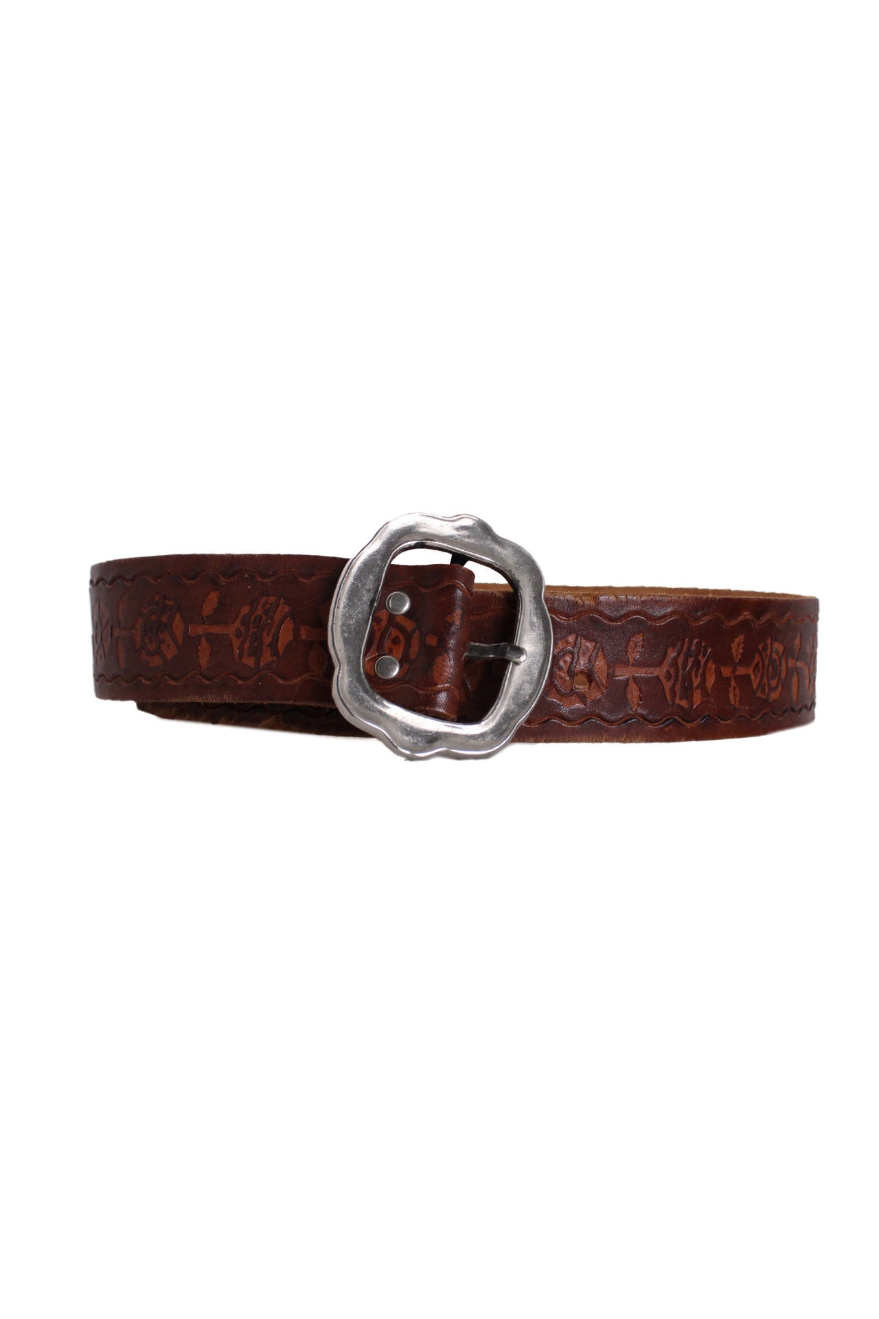 front angle vintage brown toned tooled leather belt featuring abstract floral tooled motif, adjustable 6-hole closure, and scalloped silver toned buckle.