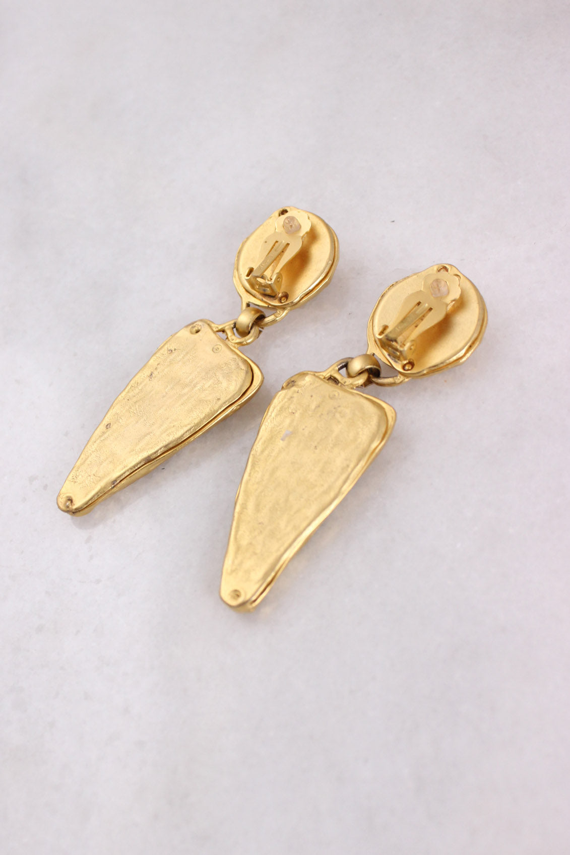 back of earrings with clip on closure. 