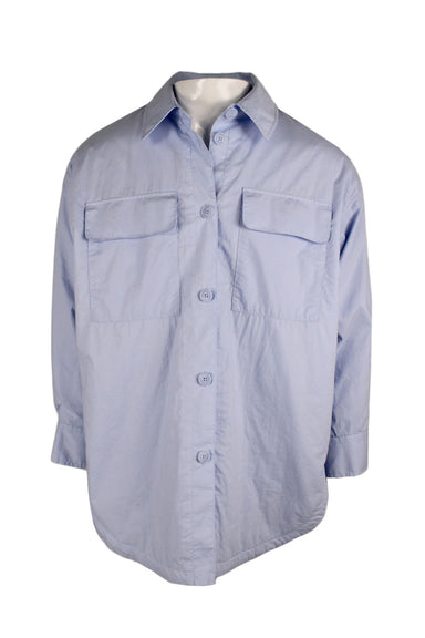 front of h&m blue cotton button up shirt featuring spread collar, 3/4 sleeves, tonal stitching, flap pockets at chest, soft shoulder pads, double button at cuffs, slit at sides, rounded hem, and button closure. 