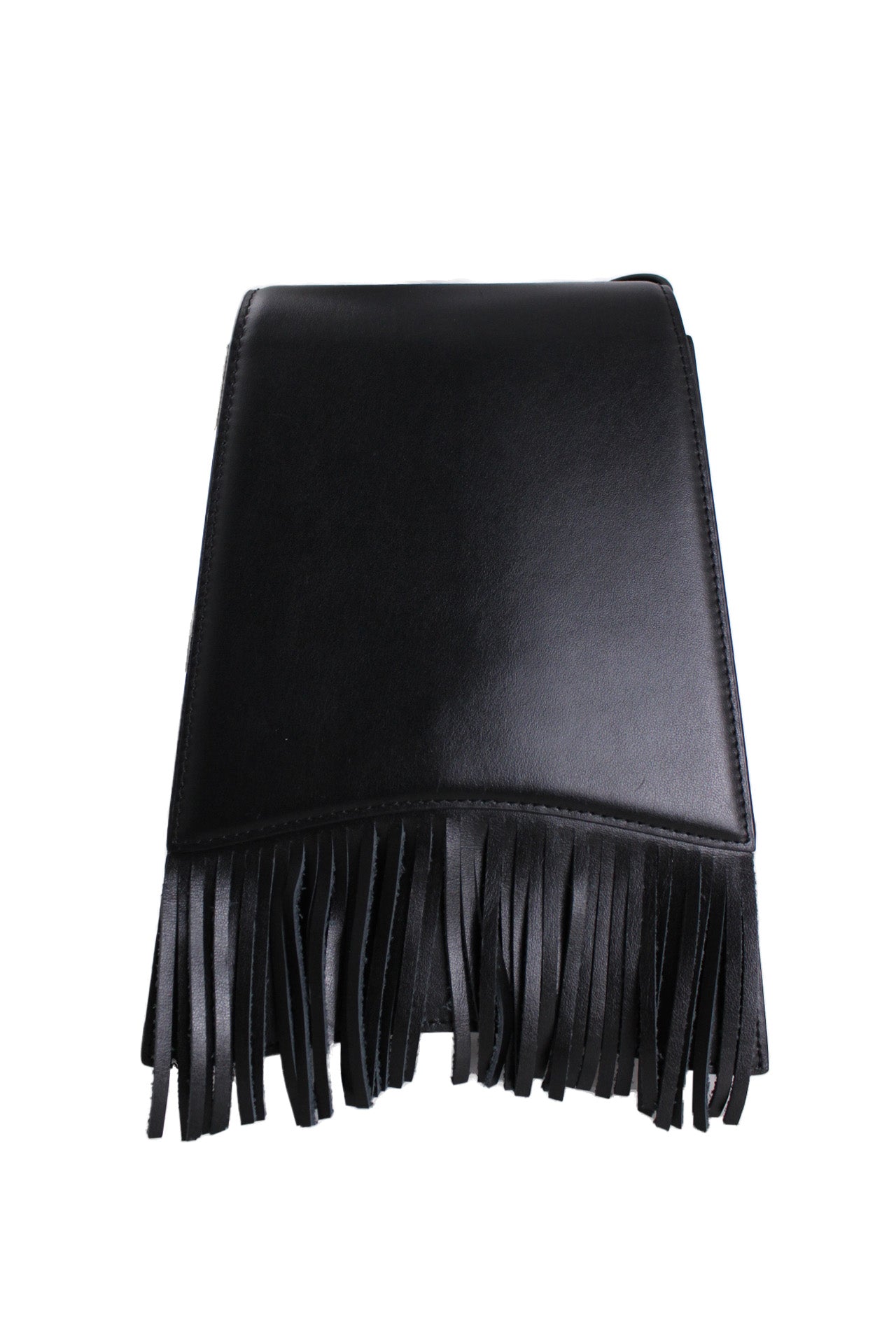 front angle of tall trapezoidal leather bag. long flap pocket on front with fringe past bottom of purse. 