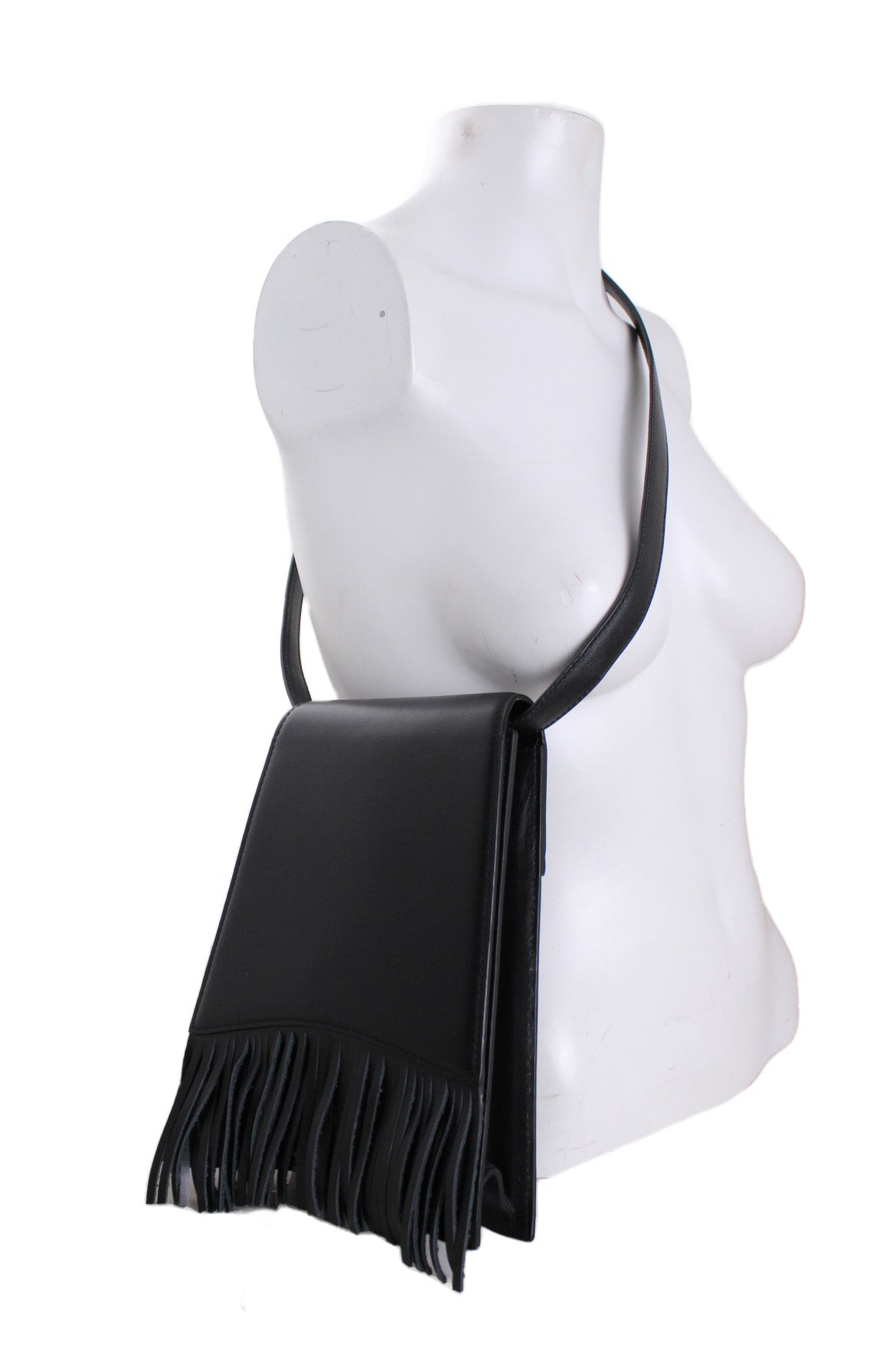 leather purse with cross body strap worn on fem mannequin bust. 