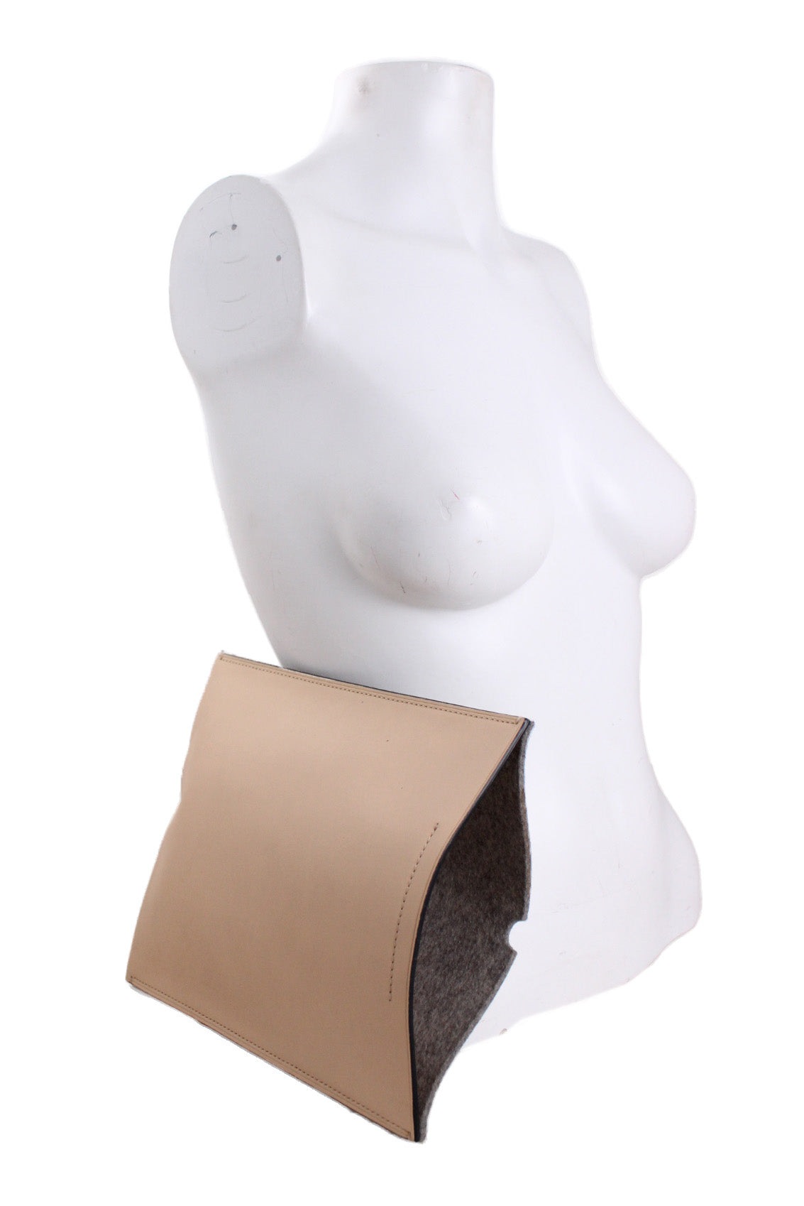 profile angle of bag positioned at side of mannequin torso.