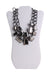 bcbg grey and mirrored statement necklace. features mirrored stones in rectangular step cut and pear cuts, held in sculptural metallic frames. includes lobster clasp