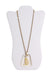 front of vintage gold toned pendant. features transparent acrylic square shape pendant, and gold toned aquarius symbol.